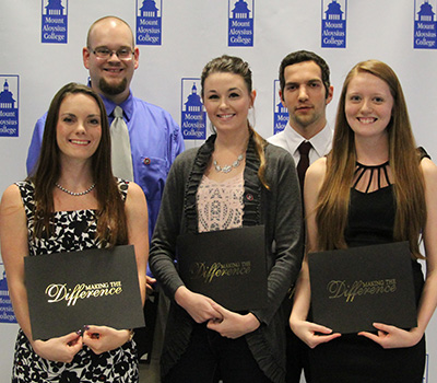 Students holding awards Students holding awards