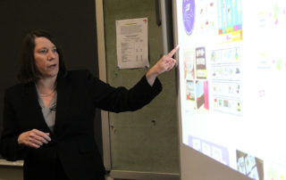 Dr. Rutledge teaches at a white board
