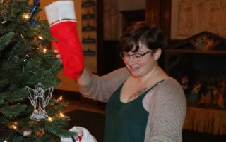 Mount student Jordyn Torrance of Tarrs, Pa. works on the Angel Tree. 195 stockings were donated by Mount students and employees for individuals in need.