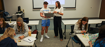Students working with a professor