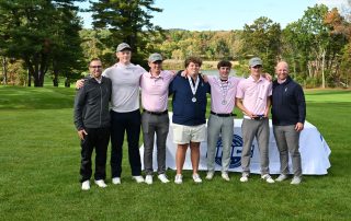 2025 Men's golf team holds the trophies they received for conference champions.