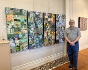 Dr. Don Talbot stands beside his piece, 'L’heure bleue' (2025, ink on textile mounted on canvas), in the Wolf-Kuhn Gallery at Mount Aloysius College.